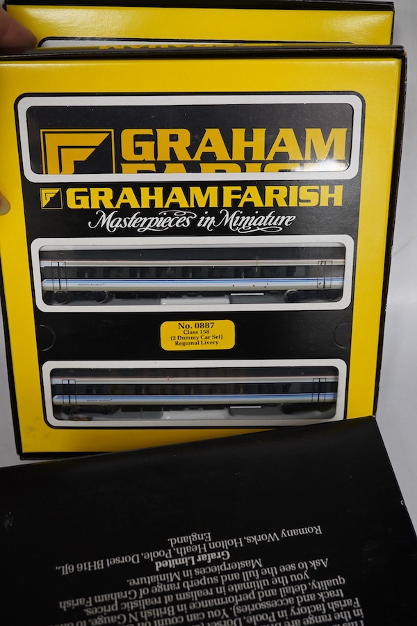 Four boxed Graham Farish N gauge railway train packs; two BR Regional Railways Class 158 2-car DMUs (8707), plus additional 2-car coach set (0887), and a Network SouthEast Class 159 3-car DMU (8748). Condition - good.